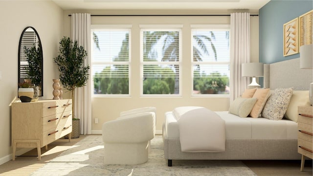 carpeted bedroom featuring baseboards