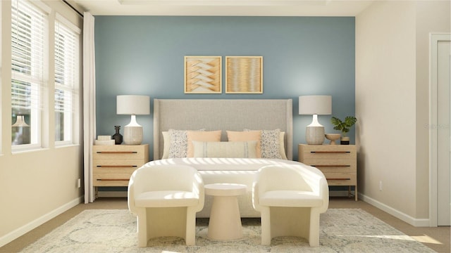 carpeted bedroom featuring baseboards