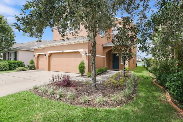 view of front of house featuring a front lawn and a garage