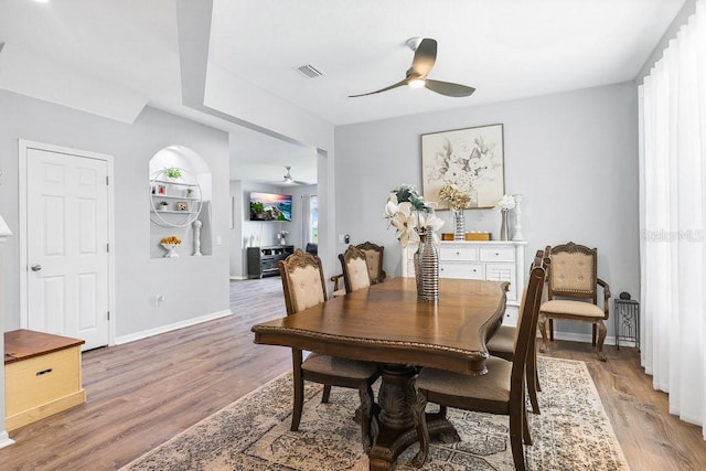 dining space featuring ceiling fan, hardwood / wood-style floors, and a wealth of natural light