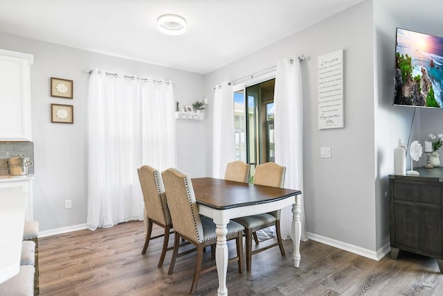 dining room featuring dark hardwood / wood-style flooring