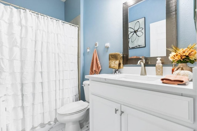 bathroom featuring vanity, toilet, and a shower with curtain