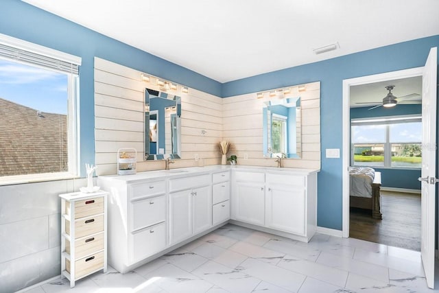 bathroom featuring ceiling fan and vanity