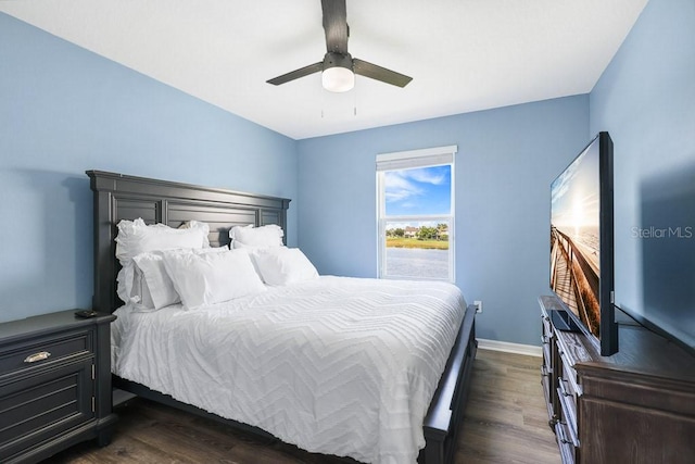 bedroom featuring dark hardwood / wood-style flooring and ceiling fan