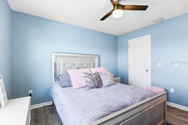 bedroom featuring ceiling fan and dark hardwood / wood-style floors