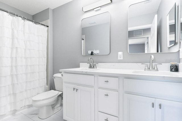 bathroom with a shower with curtain, vanity, and toilet