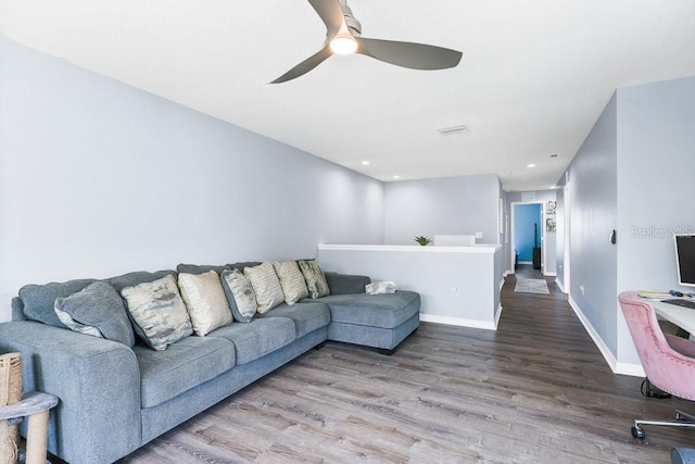 living room with ceiling fan and hardwood / wood-style flooring