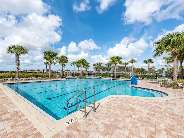 view of swimming pool featuring a patio area