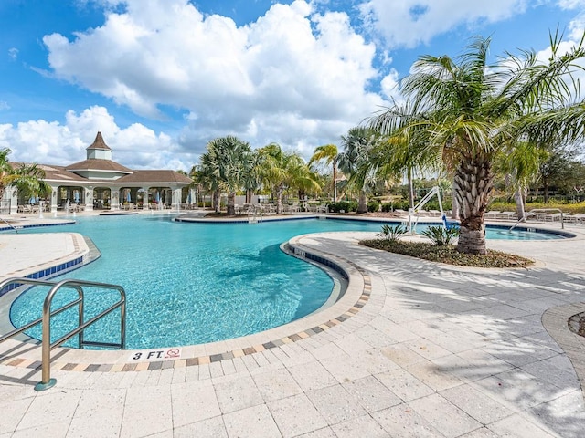 view of pool featuring a patio