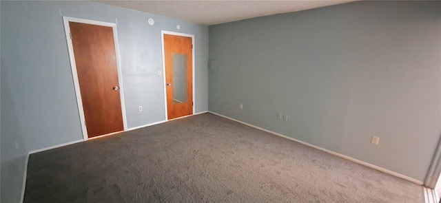 unfurnished bedroom featuring carpet and a closet