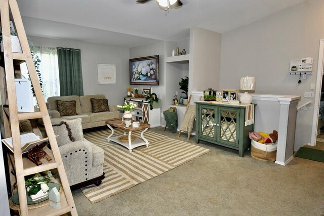 carpeted living room featuring ceiling fan