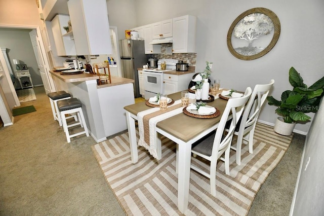 view of carpeted dining space