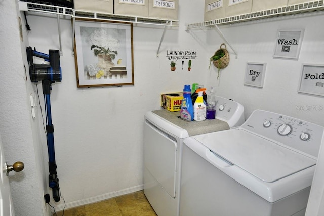 clothes washing area with independent washer and dryer and light tile patterned floors