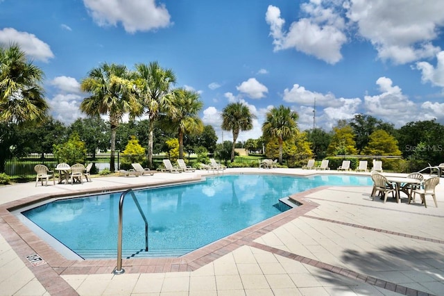 view of pool featuring a patio