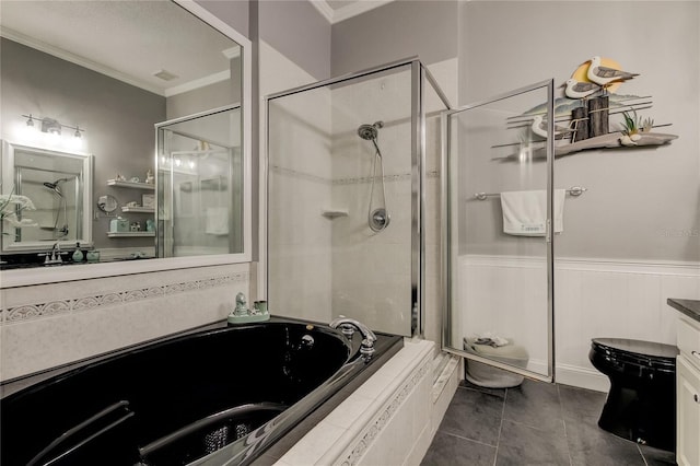 full bathroom featuring tile patterned flooring, a wainscoted wall, a garden tub, ornamental molding, and a stall shower