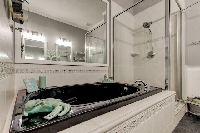 full bathroom featuring tile patterned flooring, a stall shower, tiled tub, and ornamental molding