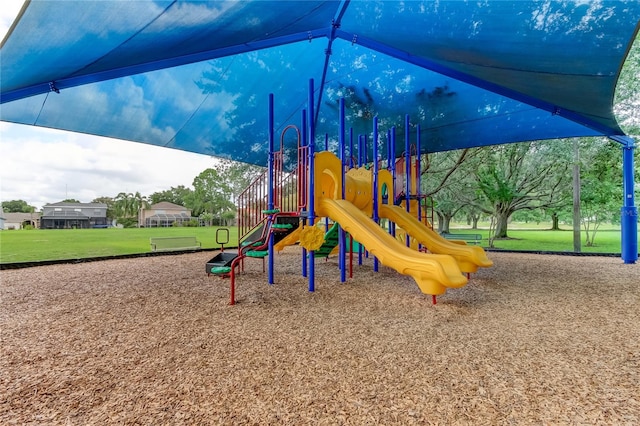 view of jungle gym with a lawn