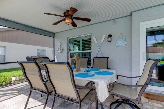 view of patio / terrace with outdoor dining space and ceiling fan