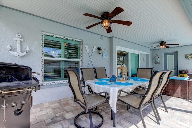 view of patio / terrace featuring outdoor dining area and a ceiling fan