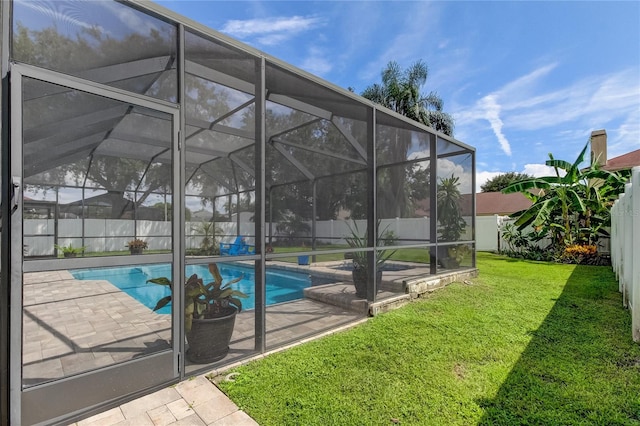 view of pool featuring a lawn, a patio, a fenced backyard, a fenced in pool, and a lanai