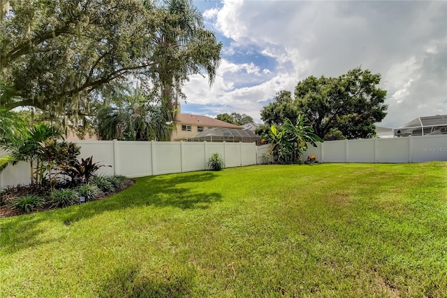view of yard with a fenced backyard