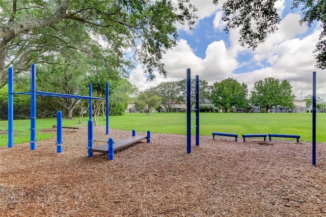 view of property's community with playground community and a lawn