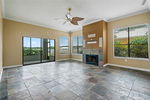 unfurnished living room with a wealth of natural light, ornamental molding, and ceiling fan