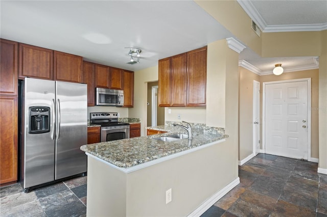 kitchen with kitchen peninsula, ornamental molding, sink, appliances with stainless steel finishes, and light stone counters