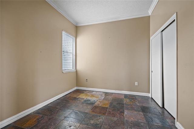 unfurnished bedroom with crown molding and a textured ceiling