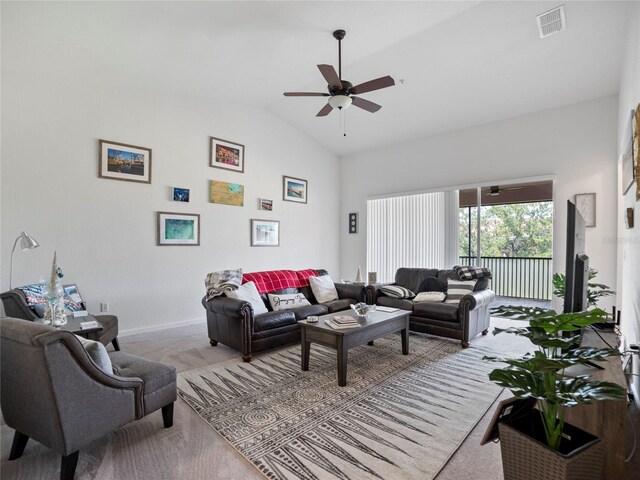 carpeted living room with lofted ceiling and ceiling fan