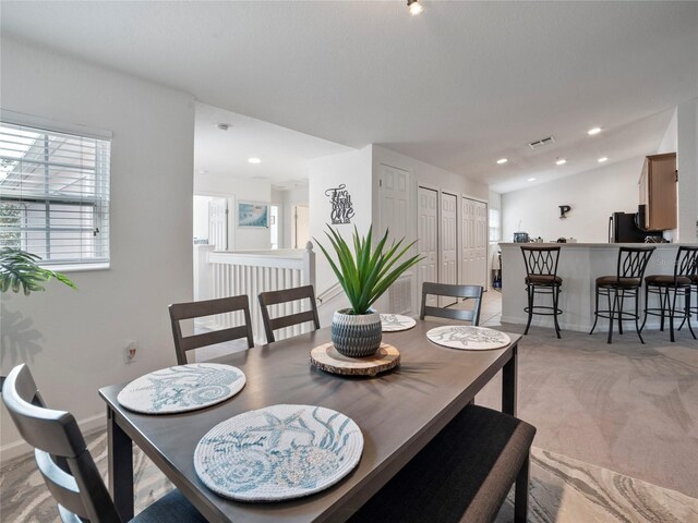 dining area with light carpet