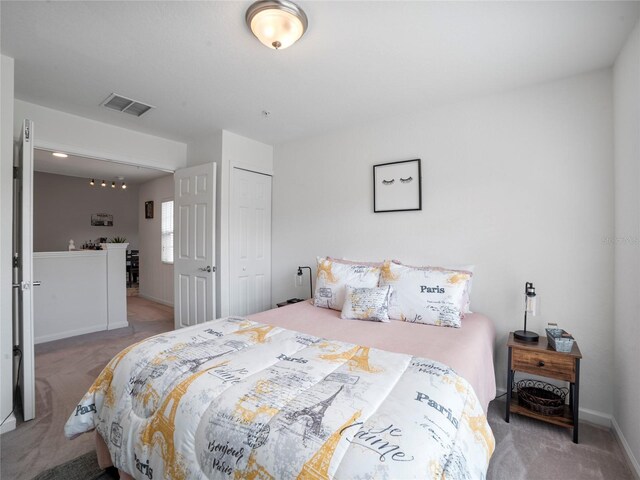 carpeted bedroom featuring a closet