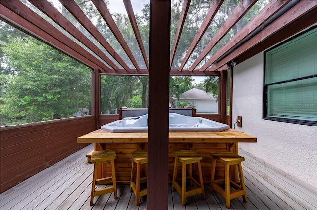 wooden deck with a pergola and an outdoor bar