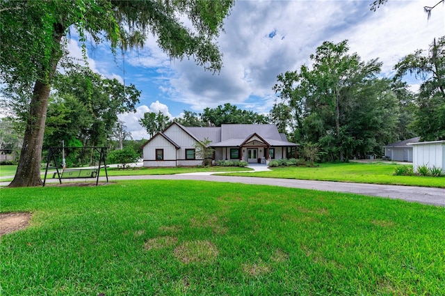 ranch-style home featuring a front yard