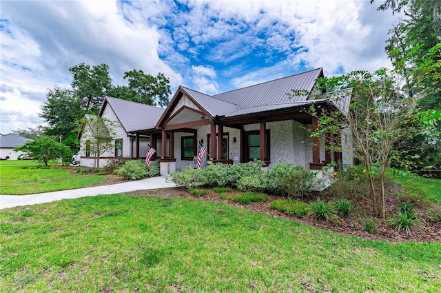 view of front of house featuring a front yard and a porch