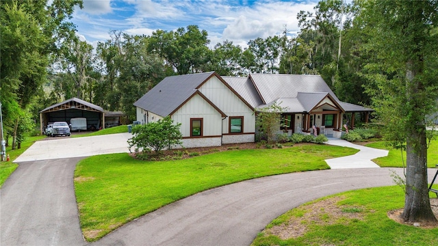 view of front facade featuring a front yard, a carport, and covered porch