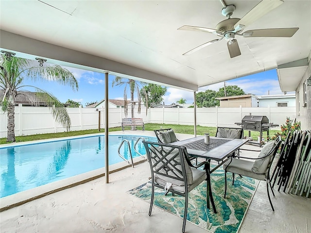 view of pool featuring grilling area, a patio, and ceiling fan