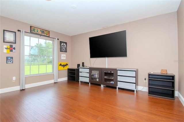 unfurnished living room with hardwood / wood-style floors