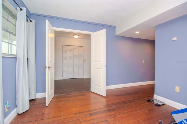 spare room featuring dark hardwood / wood-style floors