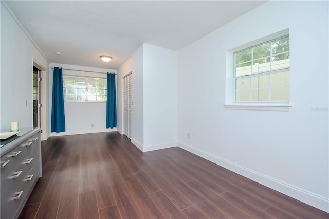 unfurnished bedroom featuring dark hardwood / wood-style flooring