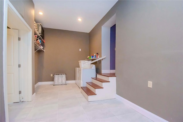 interior space featuring tile patterned flooring and washer and clothes dryer