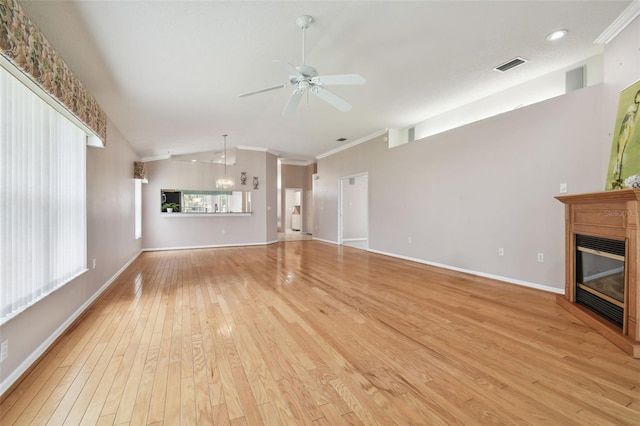 unfurnished living room featuring ceiling fan, light wood-type flooring, ornamental molding, and lofted ceiling