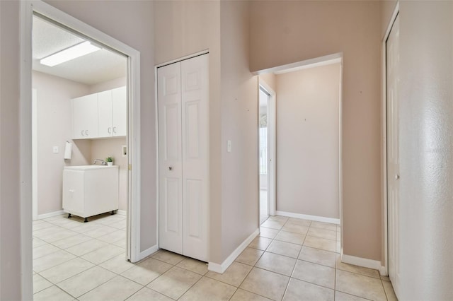 hallway featuring light tile patterned floors