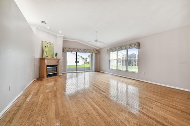 unfurnished living room featuring ornamental molding, light hardwood / wood-style floors, ceiling fan, and lofted ceiling