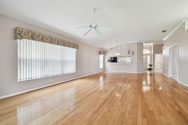 unfurnished living room with ceiling fan, light hardwood / wood-style flooring, lofted ceiling, and ornamental molding