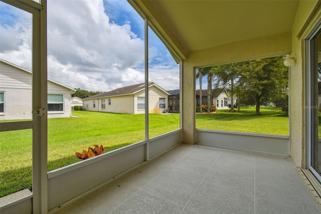 unfurnished sunroom with a wealth of natural light