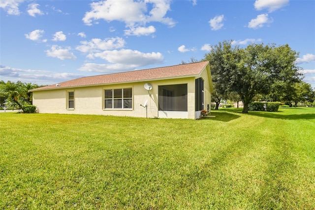 back of house with a yard