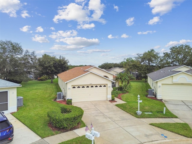 ranch-style house with a garage, a front lawn, and central air condition unit