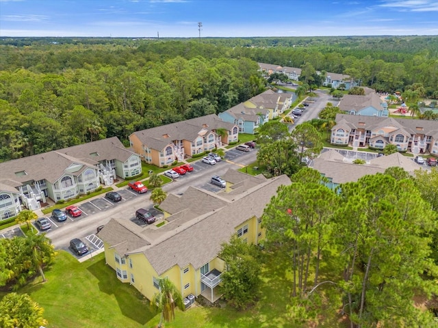 aerial view featuring a residential view and a view of trees