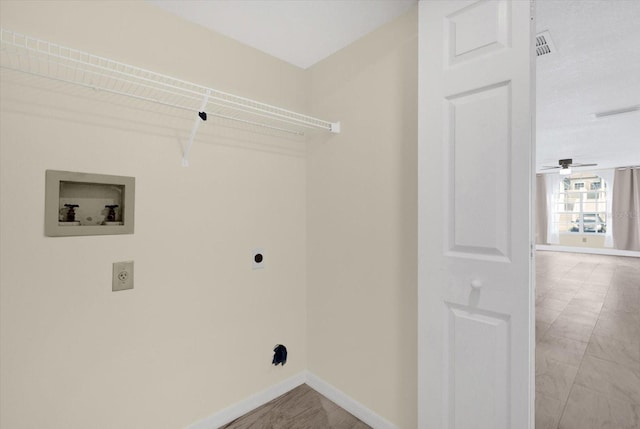 washroom with hookup for a washing machine, visible vents, baseboards, hookup for an electric dryer, and laundry area